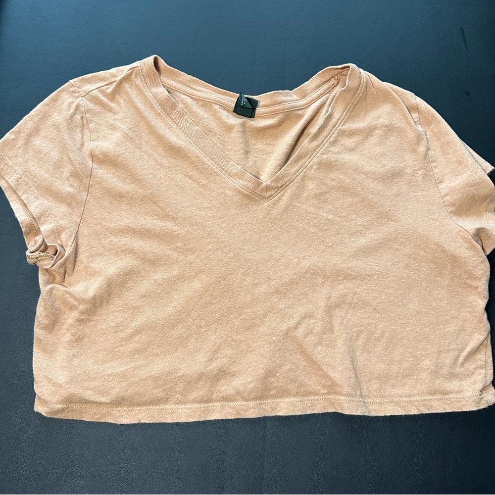 Medium orangish tanish cropped tshirt.